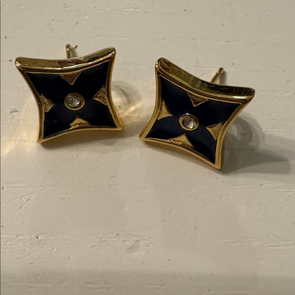 Dainty stud earrings in gold tone with blue floral and cz stone. Hypoallergenic.